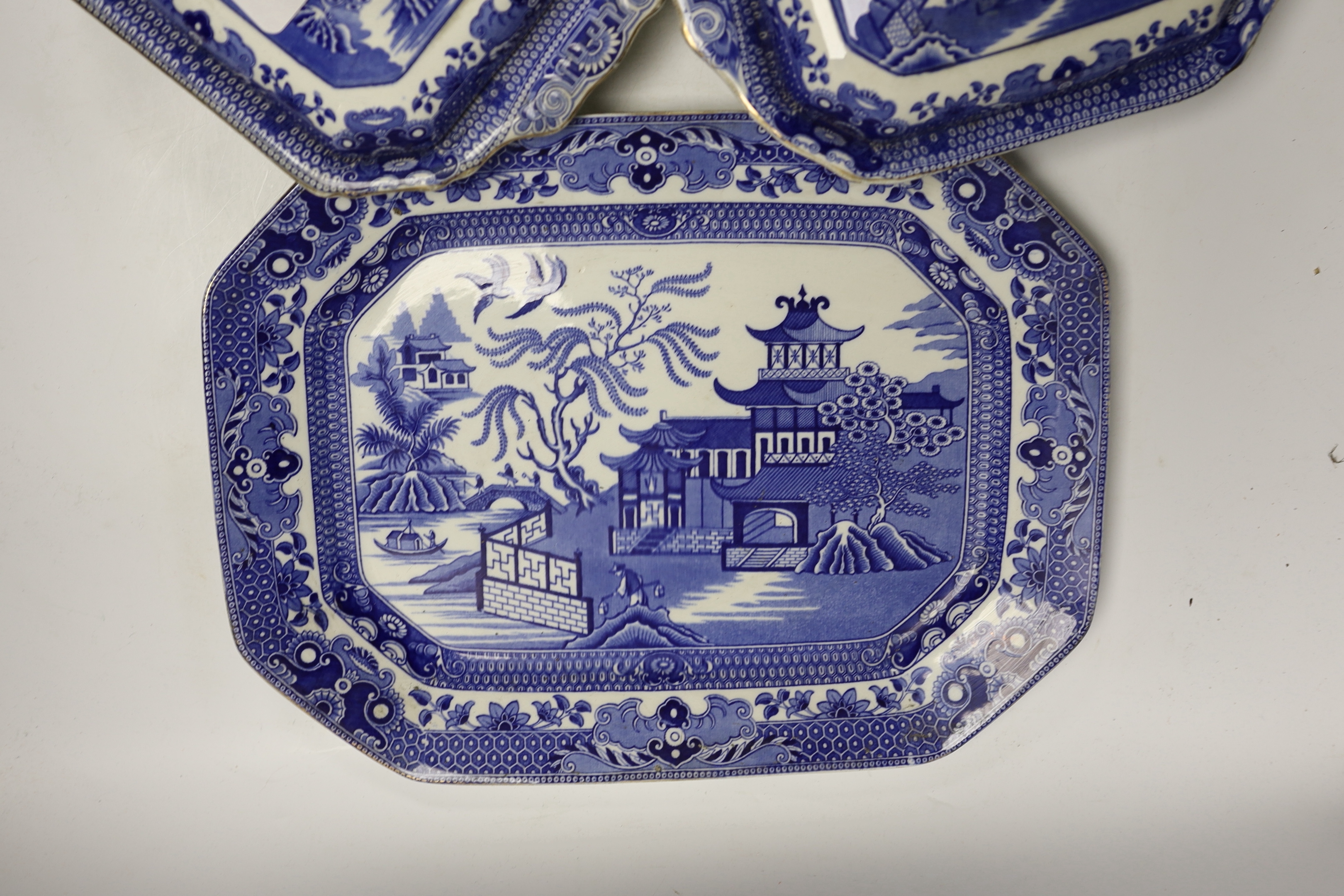 A Mason's stoneware blue and white plate, 2 tureens and a serving dish and a German model of a pug dog